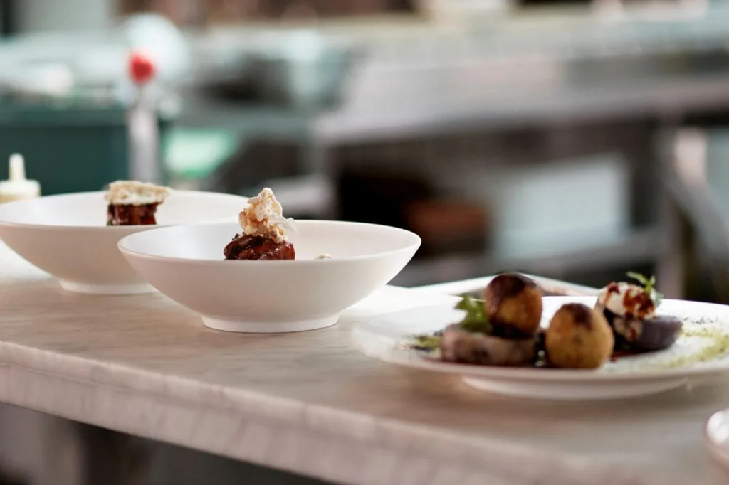 Chef pass with finished plates ready for service